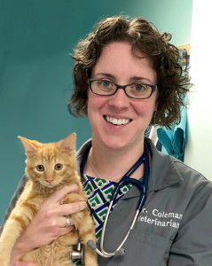Portrait of Emily Coleman DVM holding an orange kitten